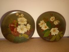 A pair of Watcombe Torquay wall hanging plates with hand painted floral decoration. Dia. 36cm.
