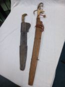 Two South/Central American machetes in embossed leather sheaths with bone and horn handles