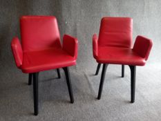 A pair of contemporary Ligne Roset red leather and ebonised beech Vik chairs, with maker's labels.
