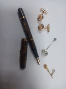 A 9ct gold spoon charm, a hallmarked silver spoon, a vintage Waterman's fountain pen with a 14ct