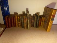 A collection of antique leather bound books to include four volumes of Don Quixote and Gullivers