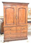 A mid 19th century mahogany linen press on plinth base. (Adapted for hanging space, comes in two