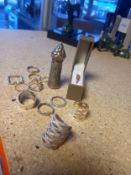 A collection of silver and white metal items to include eleven rings and an embossed seal/stamp
