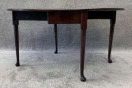 A Georgian mahogany drop flap dining table with gateleg action on slender cabriole pad foot