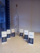 A bottle of Studer Williams eau-de-vie, along with six boxed eau-de-vie glasses by Etter. H.40cm