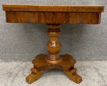 A mid 19th century mahogany tea table with fold over top raised on pedestal base. H.71 W.87 D.