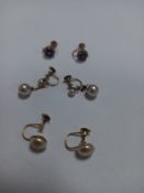 Two pairs of pearl earrings on 9ct gold mounts, and another pair of 9ct gold earrings inset with