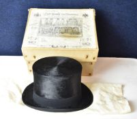 A Robert Heath of Knightsbridge silk top hat in it's original box.