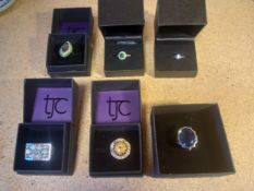A collection of six boxed 925 silver dress rings inset with various stones.
