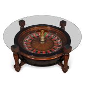 A CASINO ROULETTE WHEEL MOUNTED WITHIN A COFFEE TABLE
