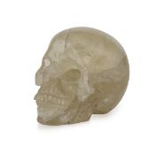 A MID 20TH CENTURY CARVED CRYSTAL MODEL OF A HUMAN SKULL