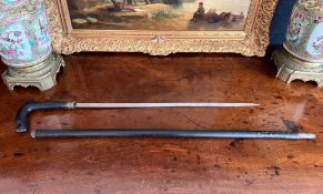 AN EARLY 20TH CENTURY INDIAN EBONISED SWORD STICK