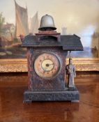 A LATE 19TH CENTURY BLACK FOREST AUTOMATON ALARM CLOCK