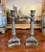 A PAIR OF EARLY 19TH CENTURY FRENCH EMPIRE ORMOLU CANDLESTICKS