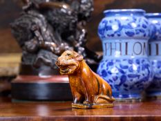 A CHINESE SANCAI GLAZED POTTERY LION BRUSH HOLDER, POSSIBLY MING DYNASTY