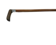 AN EARLY 20TH CENTURY RHINOCEROS HORN AND SILVER MOUNTED WALKING CANE