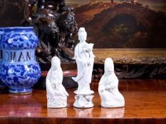 A GROUP OF THREE CHINESE QING DYNASTY BLANC DE CHINE PORCELAIN FIGURES