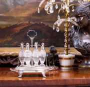 PAUL STORR: A GEORGE III PERIOD STERLING SILVER AND GLASS CRUET SET, 1805