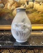 A ROYAL COPENHAGEN PORCELAIN VASE DECORATED WITH FLOWERS