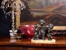 A 19TH CENTURY FRENCH BRONZE GROUP OF CHERUBS AFTER CLODION