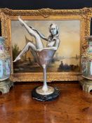 A SILVERED BRONZE EROTIC FIGURE OF A BURLESQUE DANCER