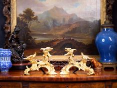 A PAIR OF MID 18TH CENTURY LOUIS XV ORMOLU CHENETS