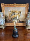 AN ART DECO STYLE COLD PAINTED BRONZE AND MARBLE FIGURE OF A DANCING GIRL