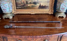 A LATE 19TH / EARLY 20TH CENTURY GERMAN BRONZE AND BAMBOO SWORD STICK