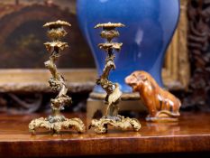 A PAIR OF MID 19TH CENTURY GILT AND PATINATED BRONZE CANDLESTICKS