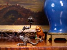 A 19TH CENTURY BRONZE RENAISSANCE REVIVAL CANDLESTICK OF DRAGON FORM