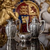 A 19TH CENTURY AUSTRIAN CHINOISERIE SILVER TEA SET, KLINKOSCH, C. 1880