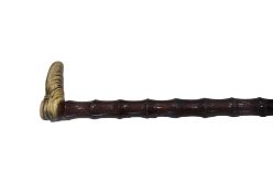 AN EARLY 20TH CENTURY CARVED BONE WALKING CANE WITH SHOE HANDLE