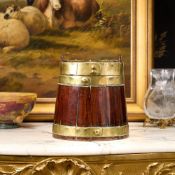 A GEORGE III COOPERED OAK AND BRASS BOUND NAVY RUM BARREL
