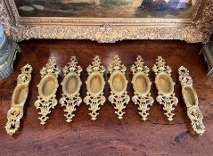 EIGHT 19TH CENTURY FRENCH GILT BRONZE DOOR HANDLES