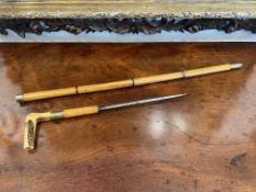 AN EARLY 20TH CENTURY CARVED BONE AND BAMBOO SWORD STICK