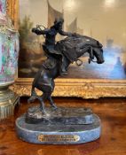 AFTER FREDERIC REMINGTON (AMERICAN,1861-1909): 'BRONCO BUSTER' BRONZE