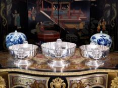 AN IMPRESSIVE SET OF THREE LARGE STERLING SILVER PUNCH BOWLS, LONDON, 1916