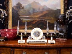 AN ART DECO PERIOD ALGERIAN ONXY AND CHAMPLEVE ENAMEL CLOCK GARNITURE