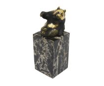 A BRONZE MODEL OF A PANDA