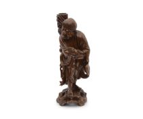 A CHINESE CARVED ROOTWOOD FIGURE OF AN IMMORTAL
