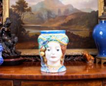 AN ITALIAN MAIOLICA VASE MODELLED AS A HEAD, CALTAGIRONE