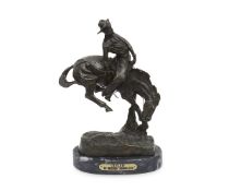 AFTER FREDERIC REMINGTON (AMERICAN,1861-1909): A BRONZE 'OUTLAW'