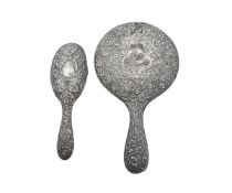 A SILVER HAIRBRUSH AND A MIRROR