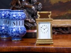 A LATE 19TH CENTURY FRENCH GILT BRASS PETITE SONNERIE CARRIAGE CLOCK WITH REPEAT