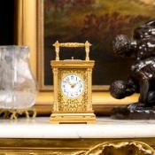 A LATE 19TH CENTURY FRENCH GILT BRASS REPEATING CARRIAGE CLOCK
