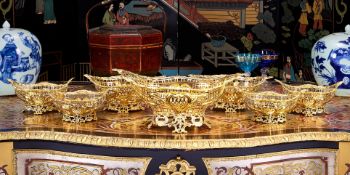 AN IMPRESSIVE SET OF SEVEN 19TH CENTURY SILVER GILT BASKETS, C. 1889, WILLIAM COMYNS & SONS