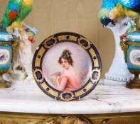 A FINE 19TH CENTURY VIENNA PORCELAIN PLATE DEPICTING A GIRL WITH DOVE