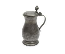 AN ANTIQUE PEWTER WINE JUG DATED 1707