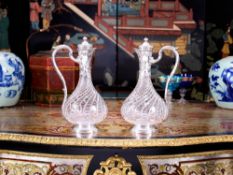 A PAIR OF LATE 19TH CENTURY FRENCH SILVER AND GLASS CLARET JUGS BY BOIN TABURET