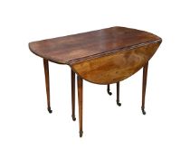 A MID 19TH CENTURY FRENCH MAHOGANY DROP LEAF DINING TABLE